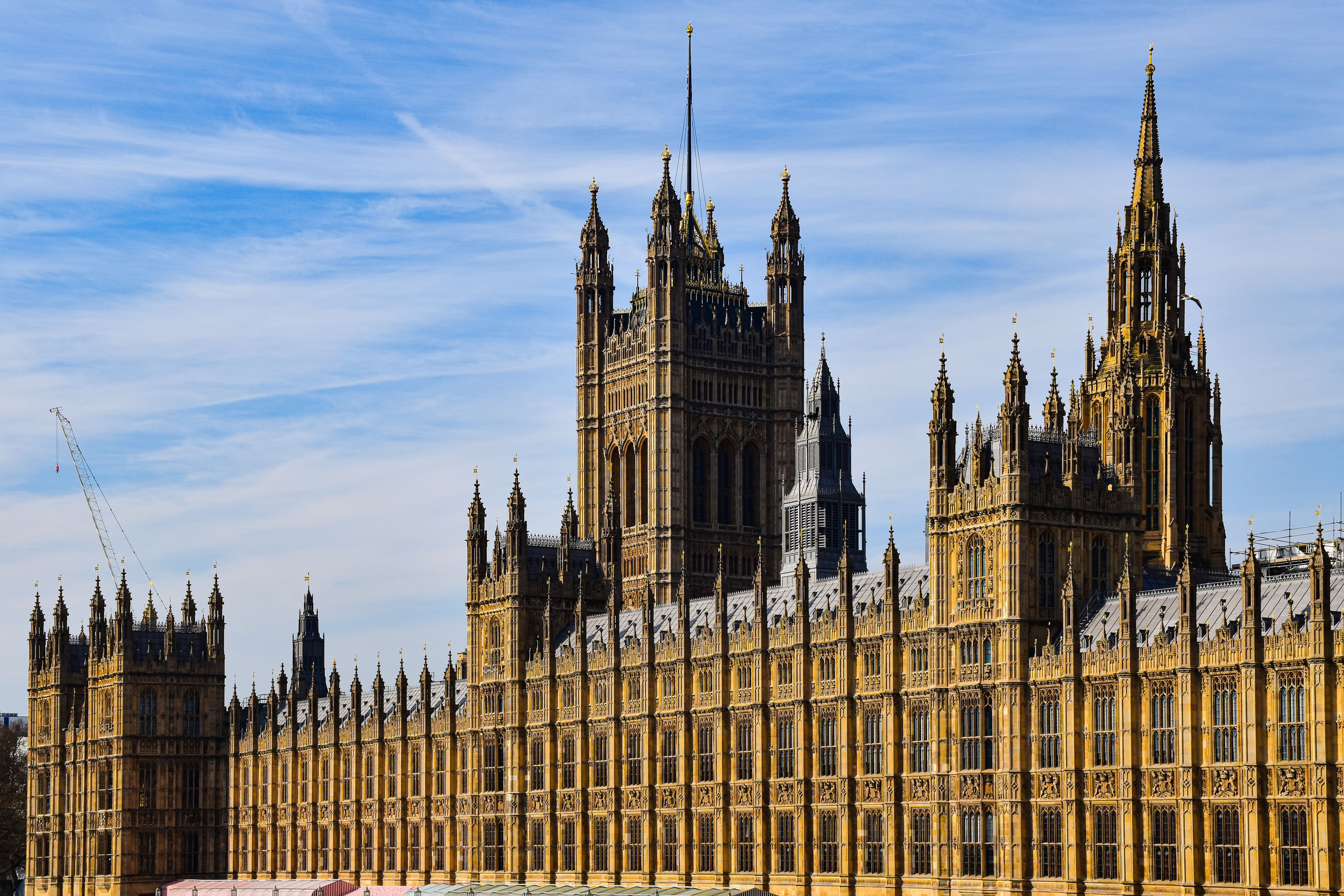 Palace of Westminster parliament building under a clear blue sky